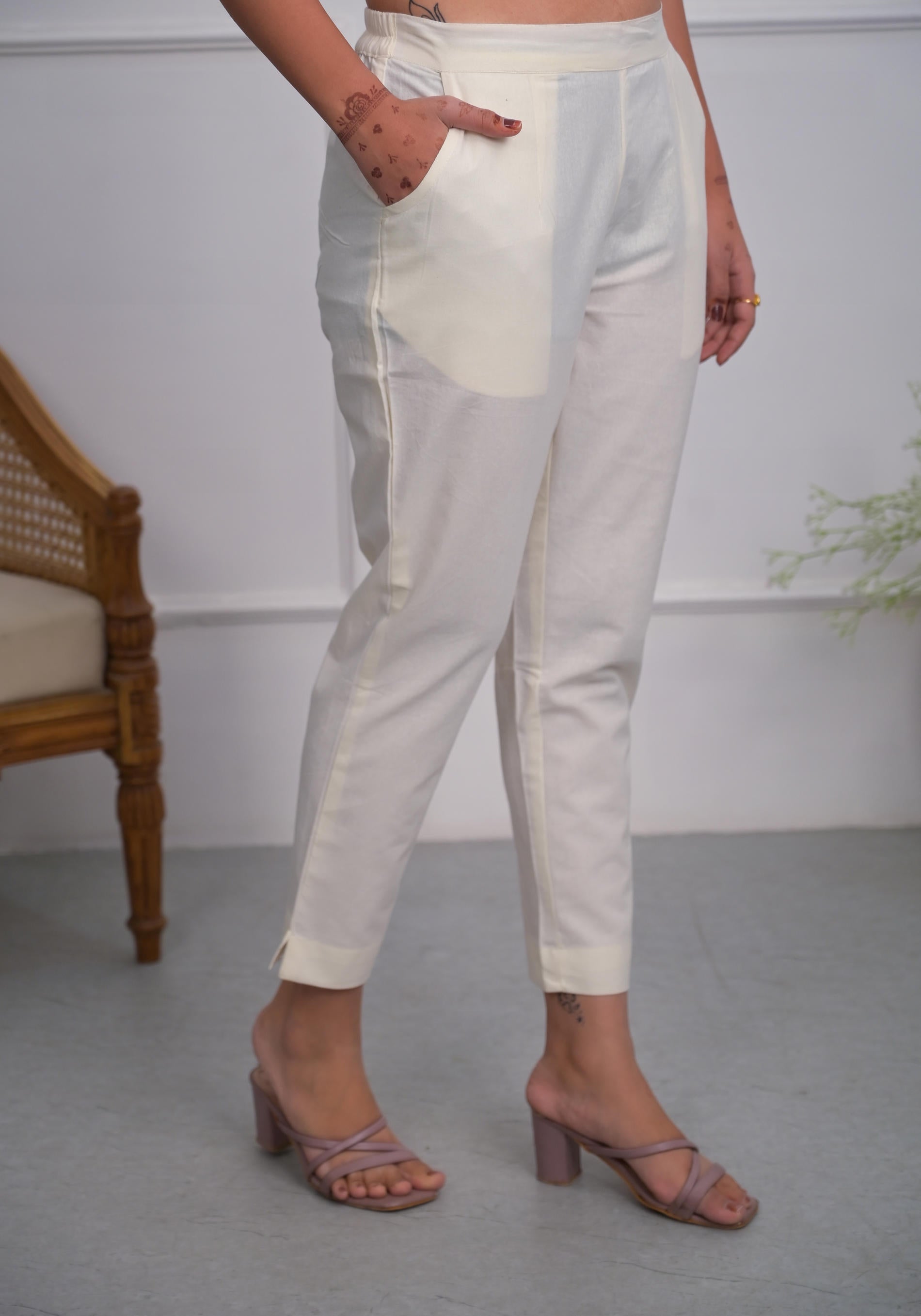 Off White Solid Cotton Pants With Partially Elasticated Waistband And Two Side Pockets