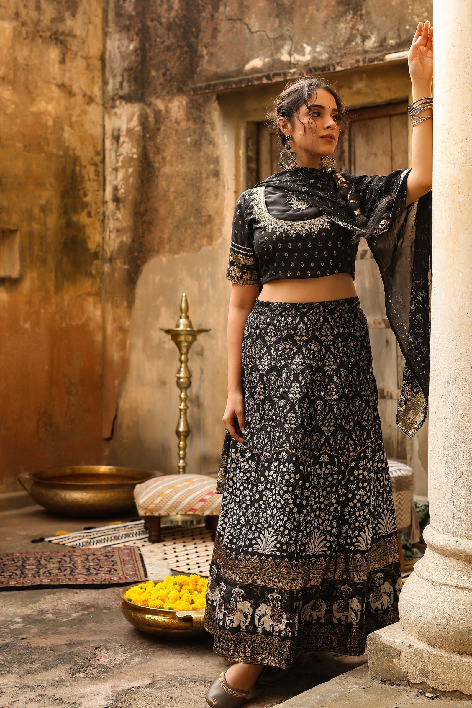 Juniper Black Ethnic motif Printed Shantoon Lehenga Choli & Dupatta Set With Zari Work Embroidery.