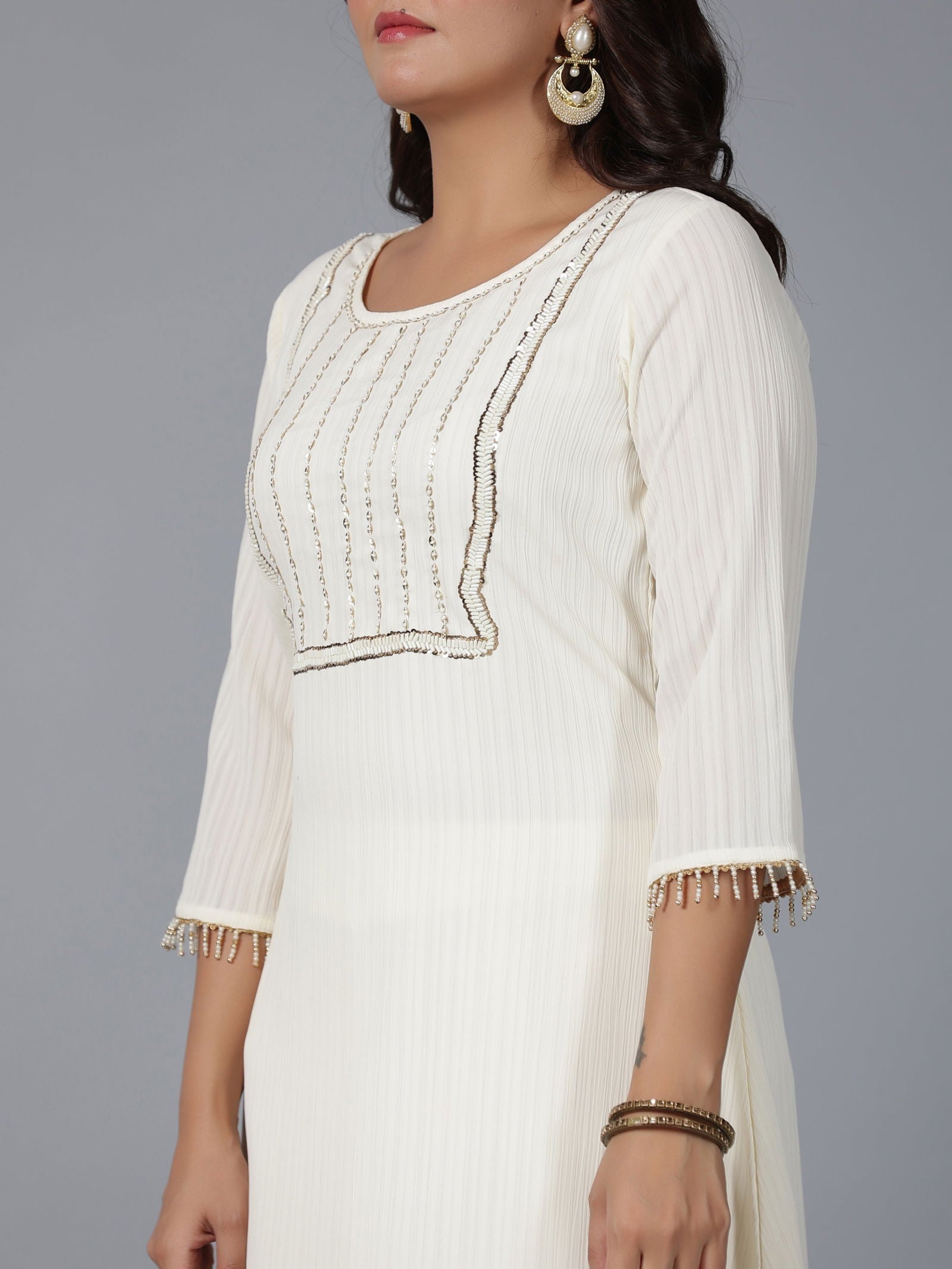 Juniper Ivory Magnus Embellished High-Low Kurta and Pants Set.