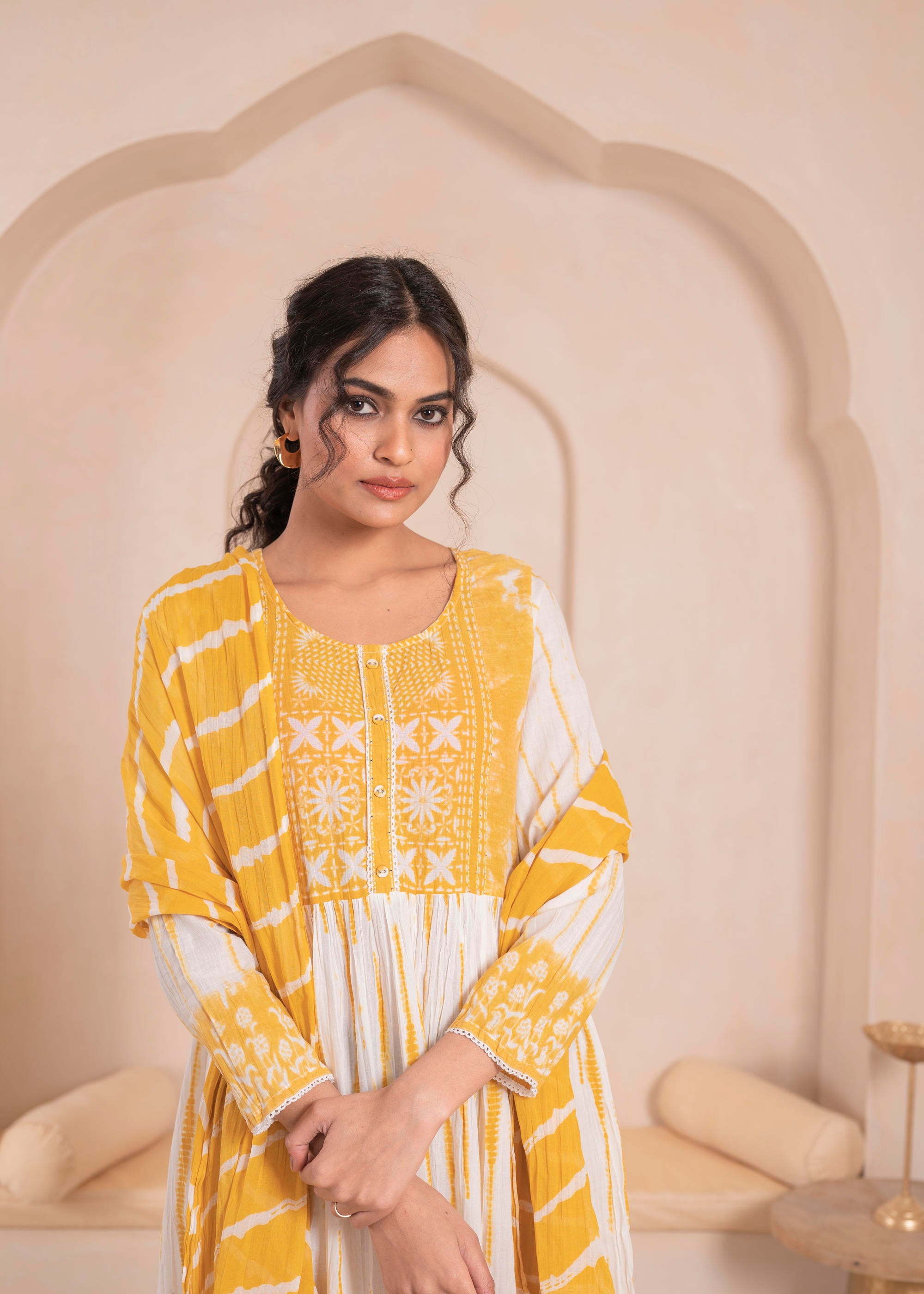 Mustarad and white kurta , solid bottom and tie - dye dupatta with cotton lace , buttons , sequince