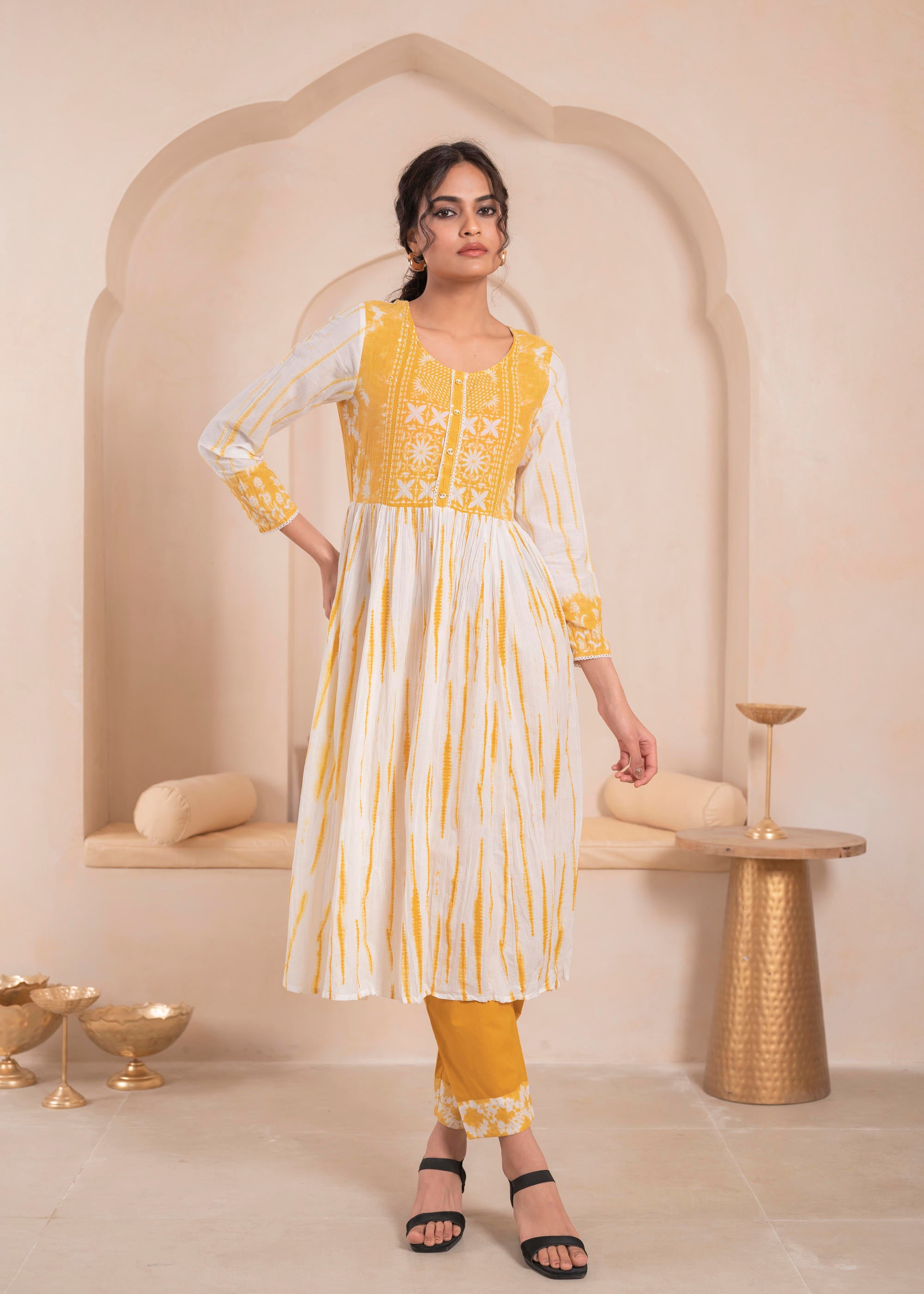 Mustarad and white kurta , solid bottom and tie - dye dupatta with cotton lace , buttons , sequince
