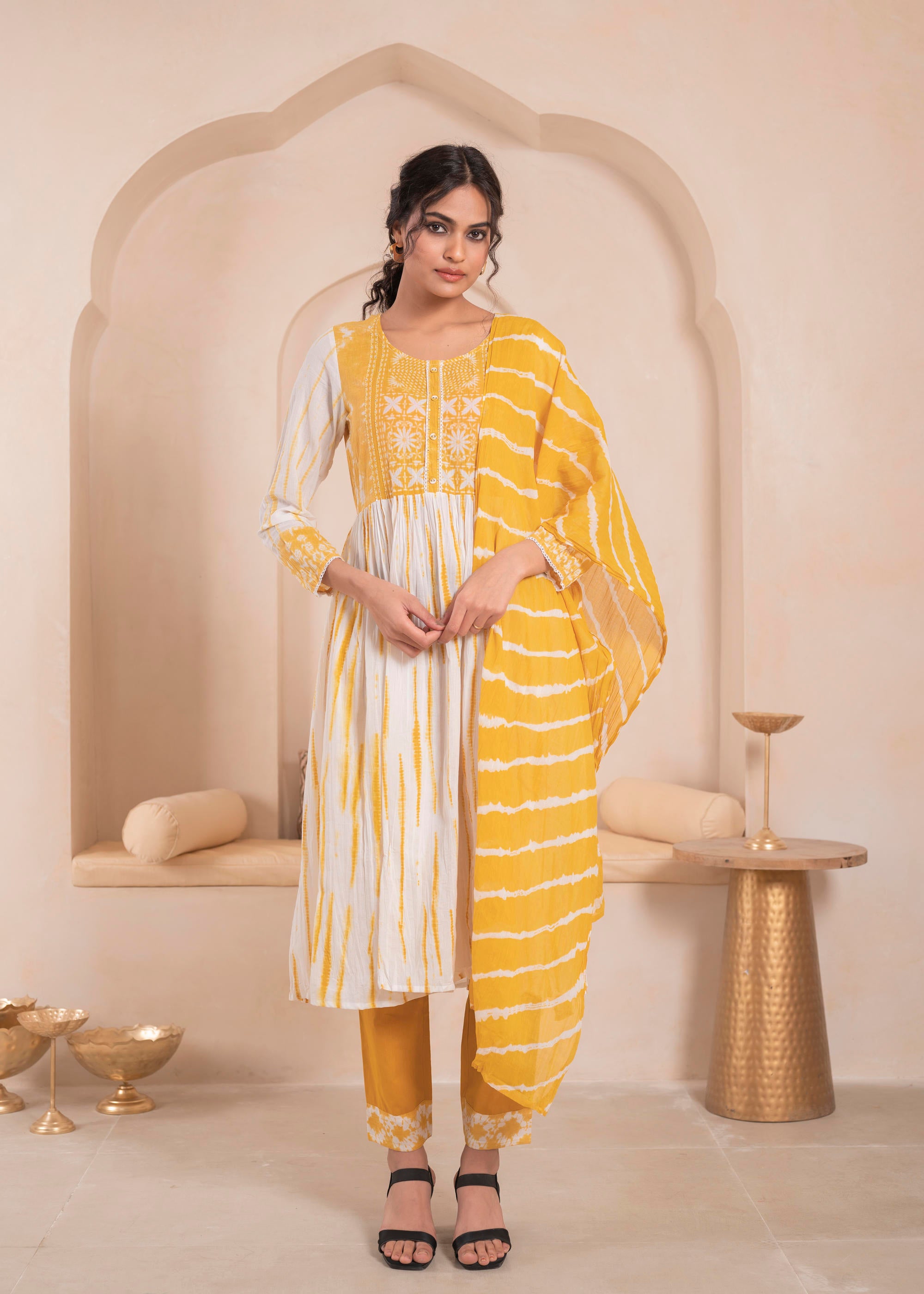 Mustarad and white kurta , solid bottom and tie - dye dupatta with cotton lace , buttons , sequince