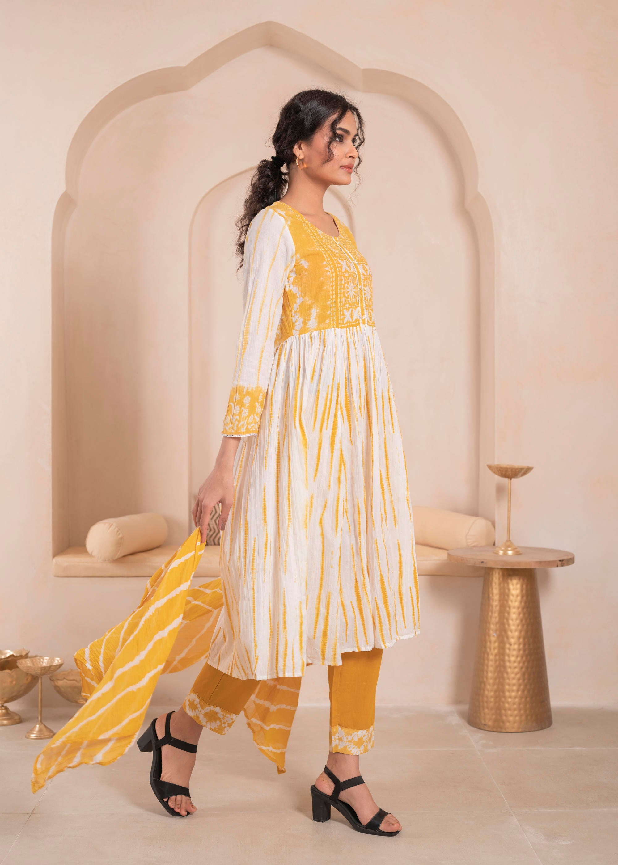 Mustarad and white kurta , solid bottom and tie - dye dupatta with cotton lace , buttons , sequince