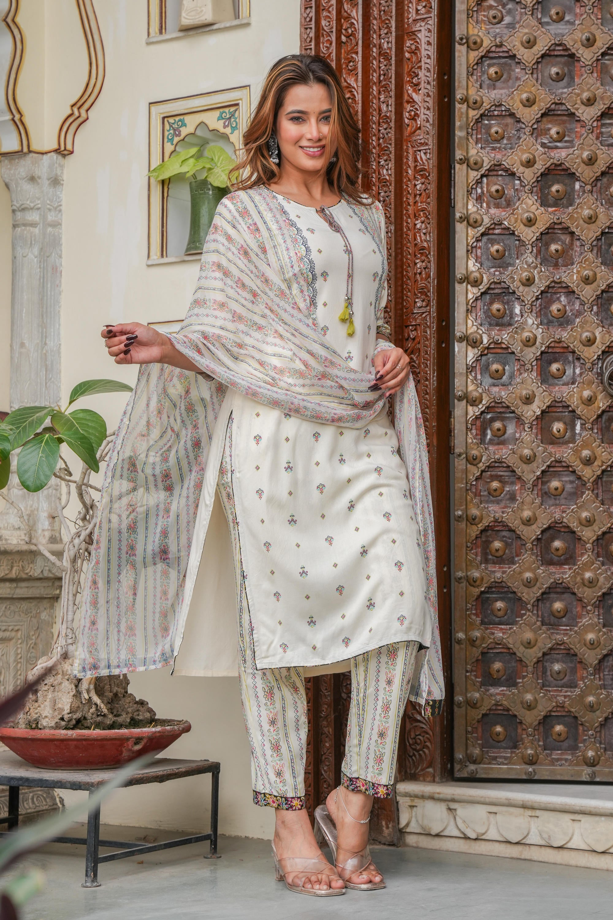 Off white printed kurta , Printed bottom and floral dupatta with dori and tassel