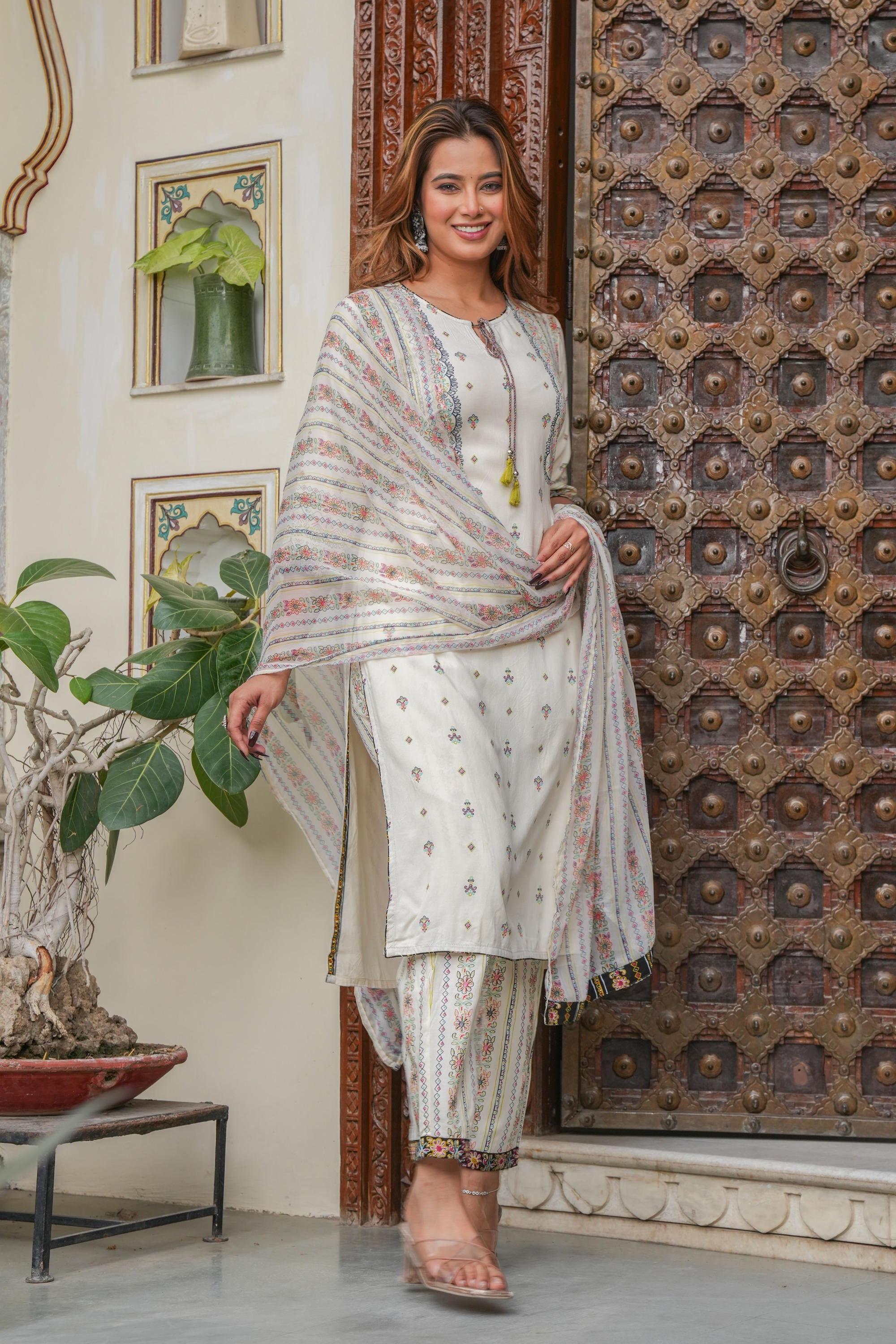 Off white printed kurta , Printed bottom and floral dupatta with dori and tassel