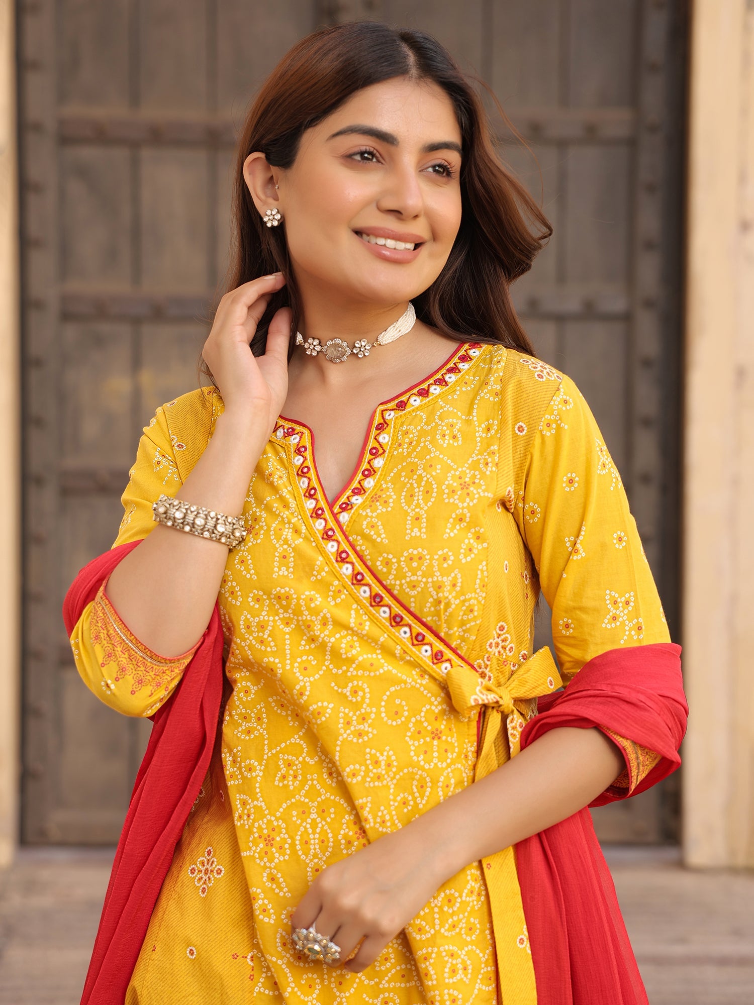 Juniper Mustard Bandhani Print Angrakha Cotton Kurta With Pants & Dupatta Set With Mirror Work Embroidery