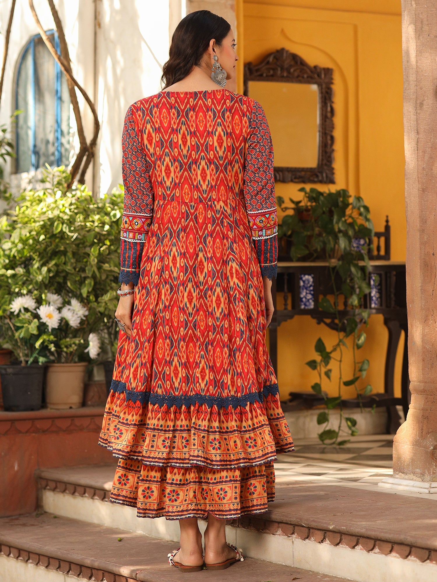 Juniper Rust Cotton Ikat Printed Layered Maxi Dress With Thread Embroidery & Dori Tassel Tie-Up At Waist