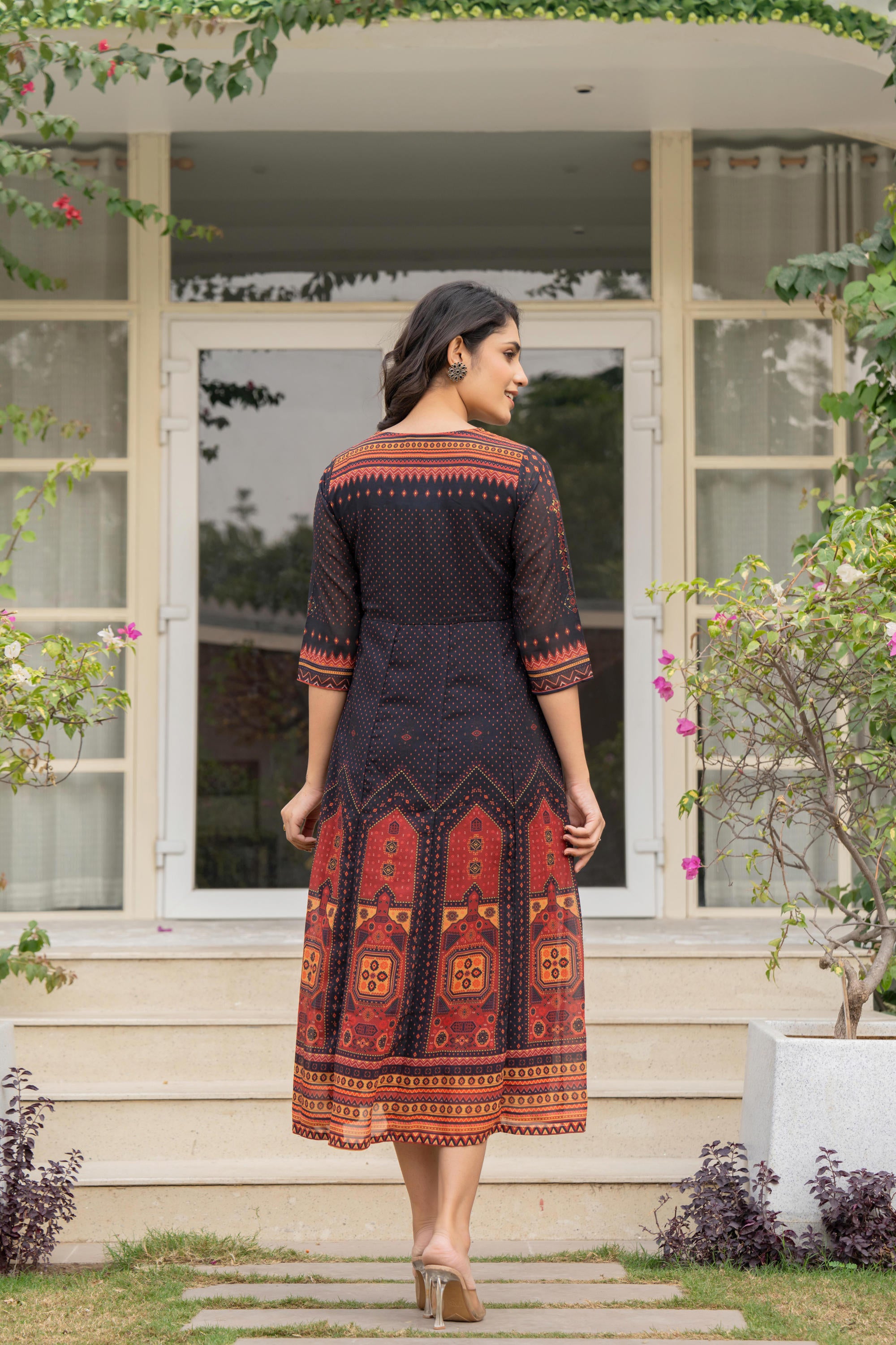 Black Ethnic Motif Printed Georgette Dress With Doris & Tassels