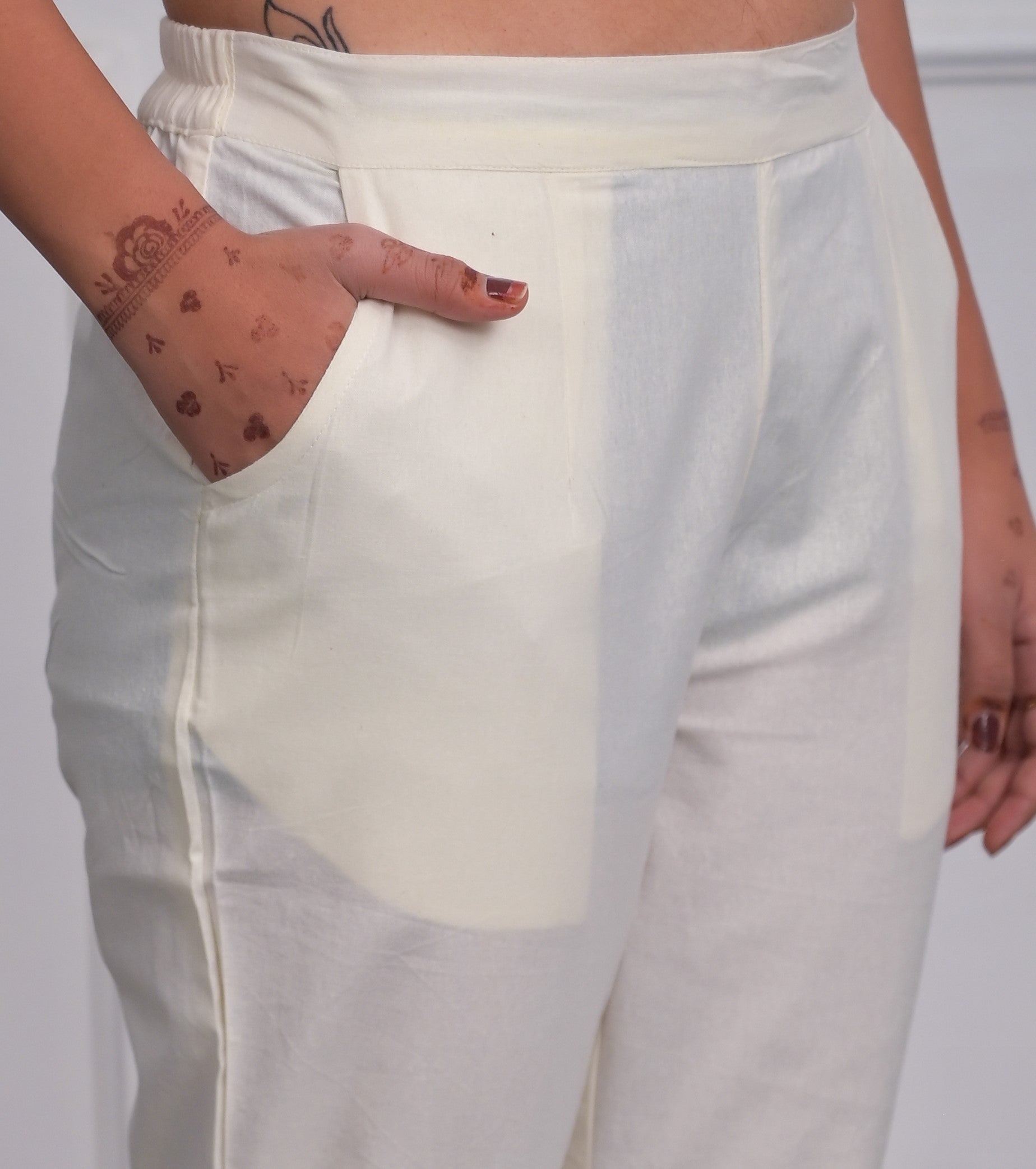 Off White Solid Cotton Pants With Partially Elasticated Waistband And Two Side Pockets