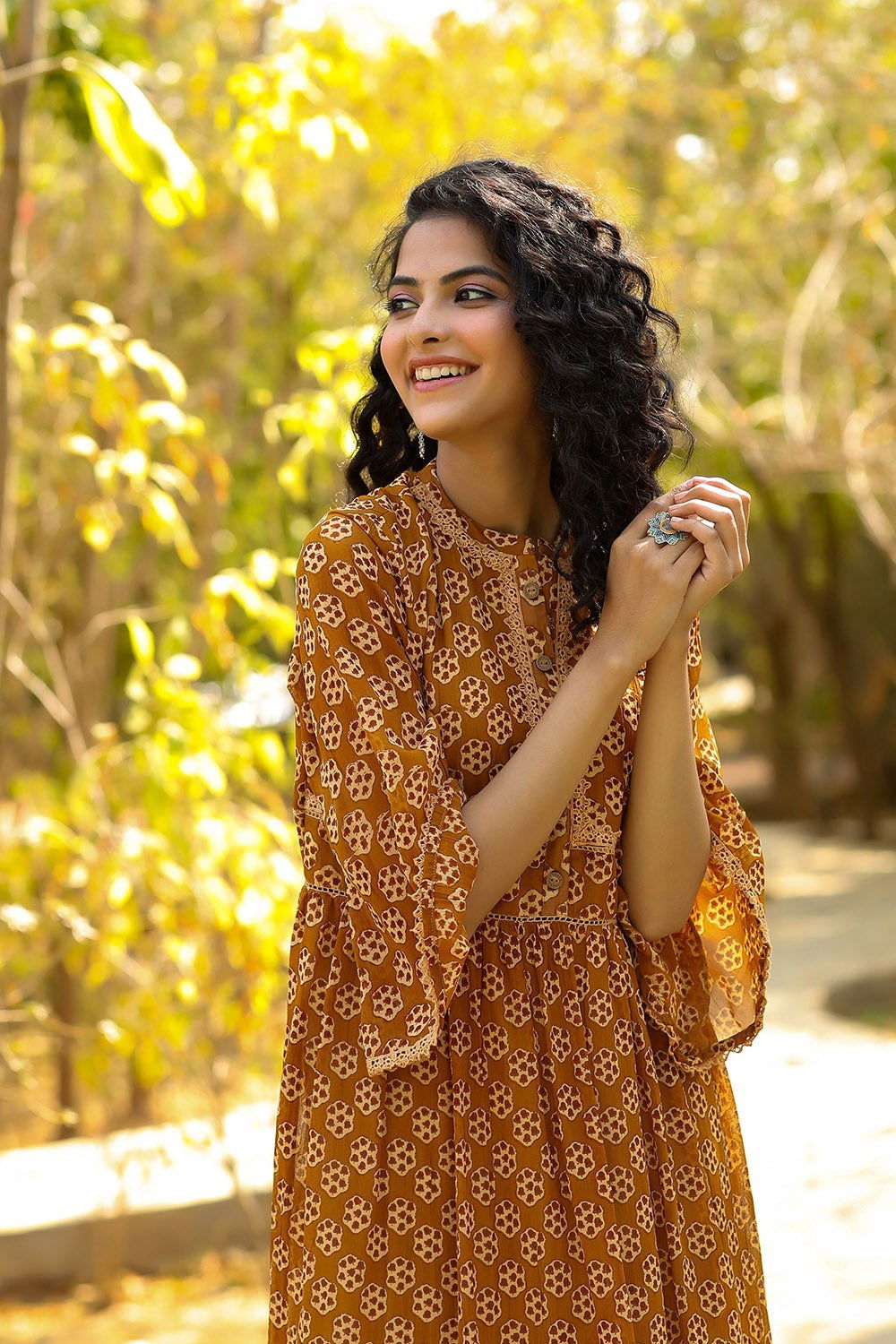 Juniper Brown Ethnic Motif Printed Georgette Maxi dress with Lace Work 