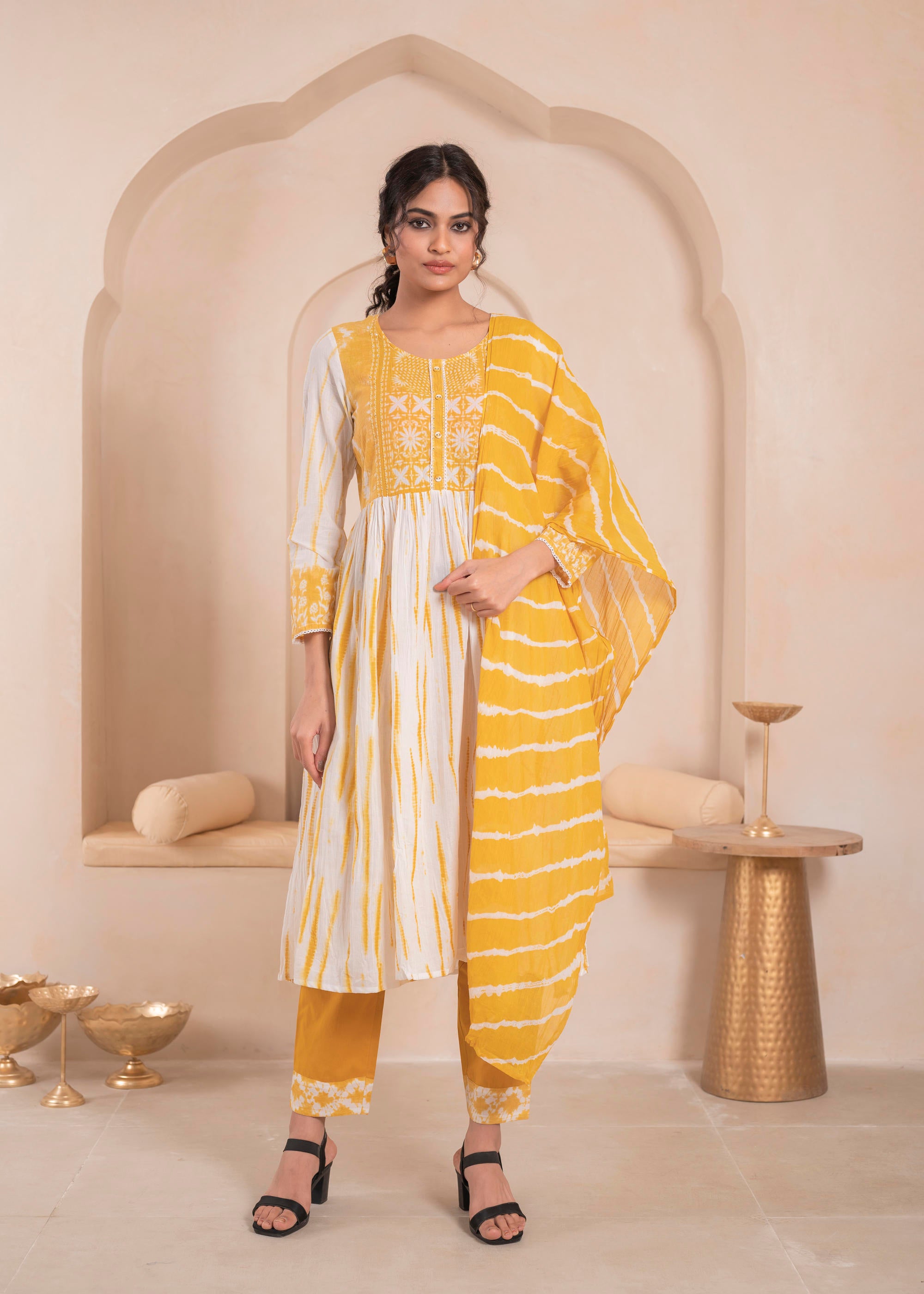 Mustarad and white kurta , solid bottom and tie - dye dupatta with cotton lace , buttons , sequince