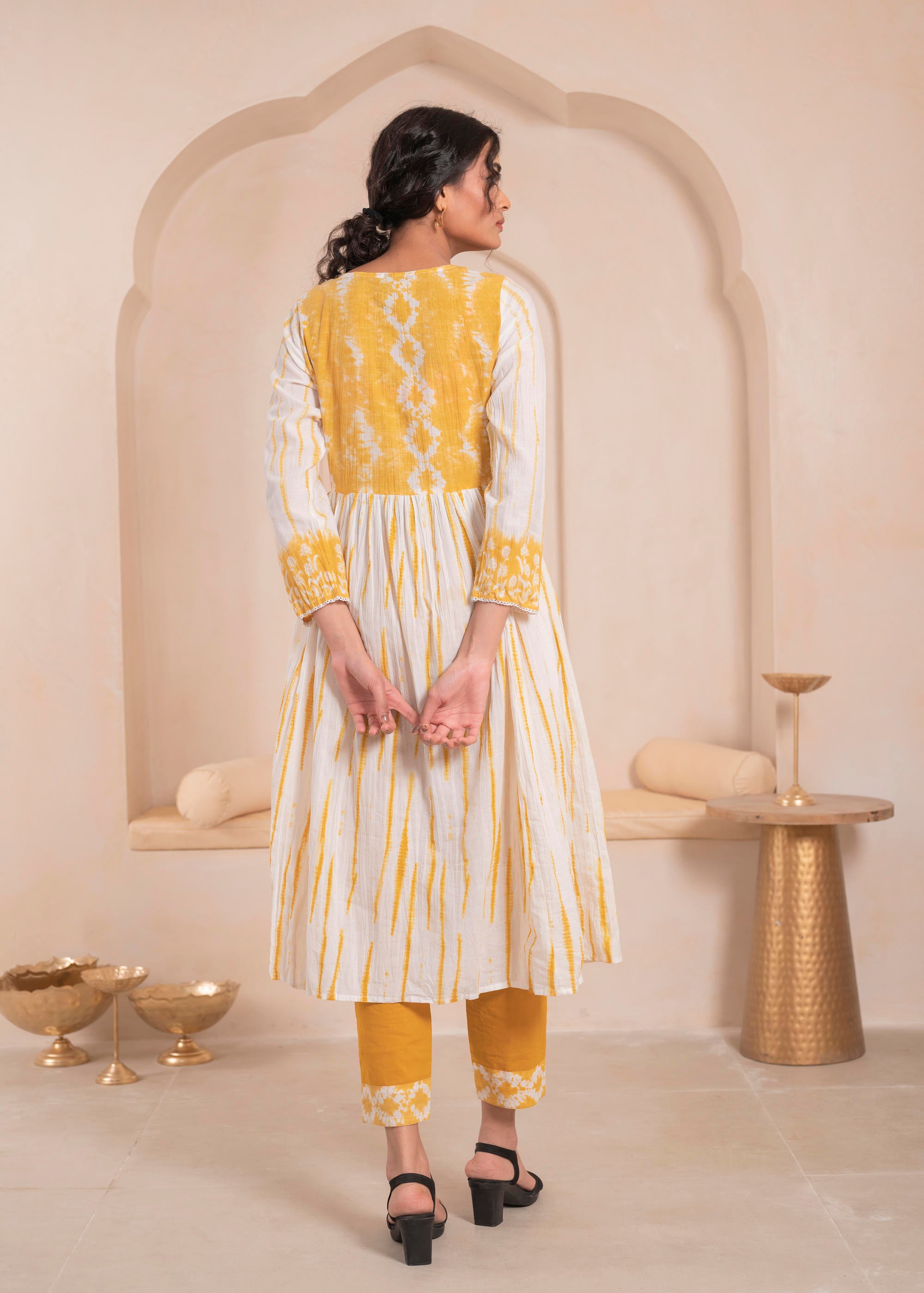 Mustarad and white kurta , solid bottom and tie - dye dupatta with cotton lace , buttons , sequince
