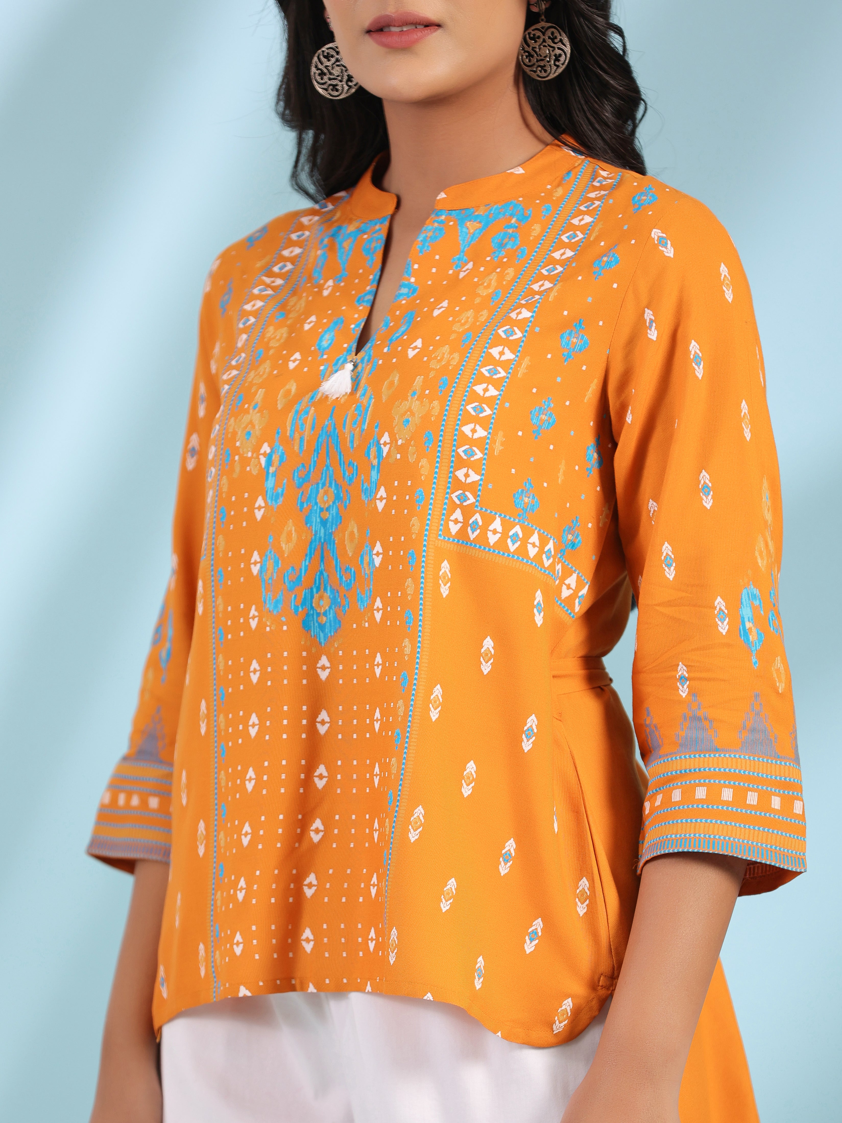 Juniper Mustard Rayon Ikat Placement Printed High-Low Tunic With Side Slits & Tassels